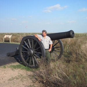 Rolando Garza, National Park Service Photo of the presenter standing next to a 19th century artillery cannon.