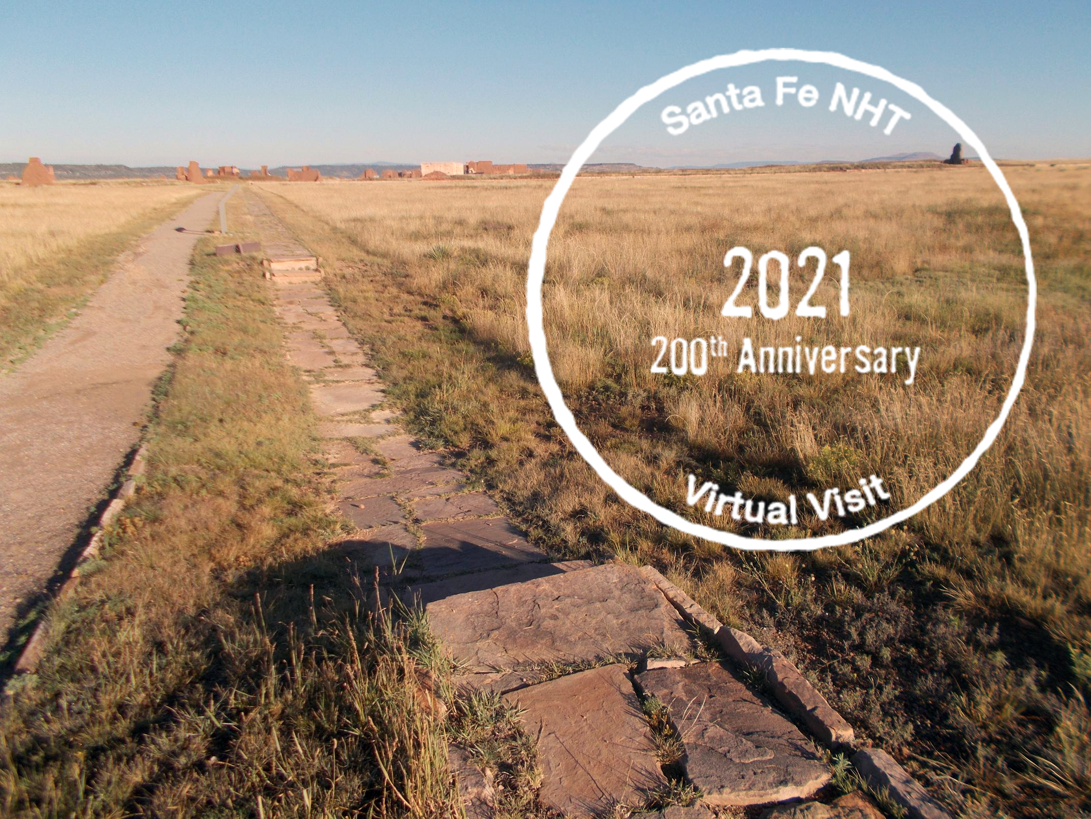 Ruts at Fort Union with 200th Anniversary virtual passport stamp Ruts in a golden grassy field with a circular stamp on top of the image