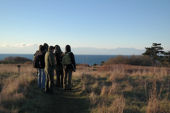 Pacific West Regional FMSS & Cultural Landscapes team with San Juan Island National Historical Park staff hiking through American Camp Cultural Landscape, December 2013. Pacific West Regional FMSS & Cultural Landscapes team with San Juan Island National Historical Park staff hiking through American Camp Cultural Landscape, December 2013.