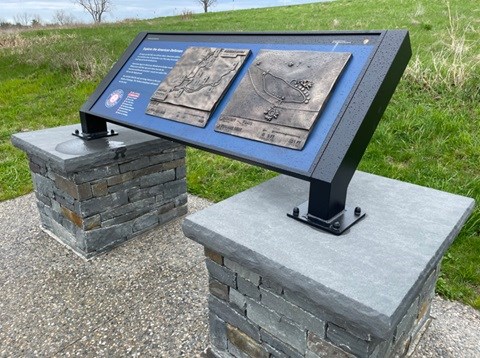 Orientation panel for Tour Stop 2. Two bronze relief maps constructed on wayside with two pillars below the legs showing location along the tour.
