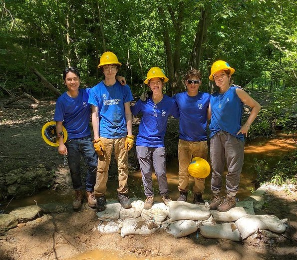 SCA members standing on progress of dam at Dumbarton Oaks Park 2 SCA members standing on progress of dam at Dumbarton Oaks Park 2