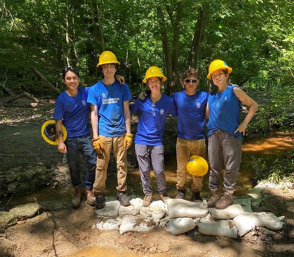 SCA members standing on progress of dam at Dumbarton Oaks Park 2