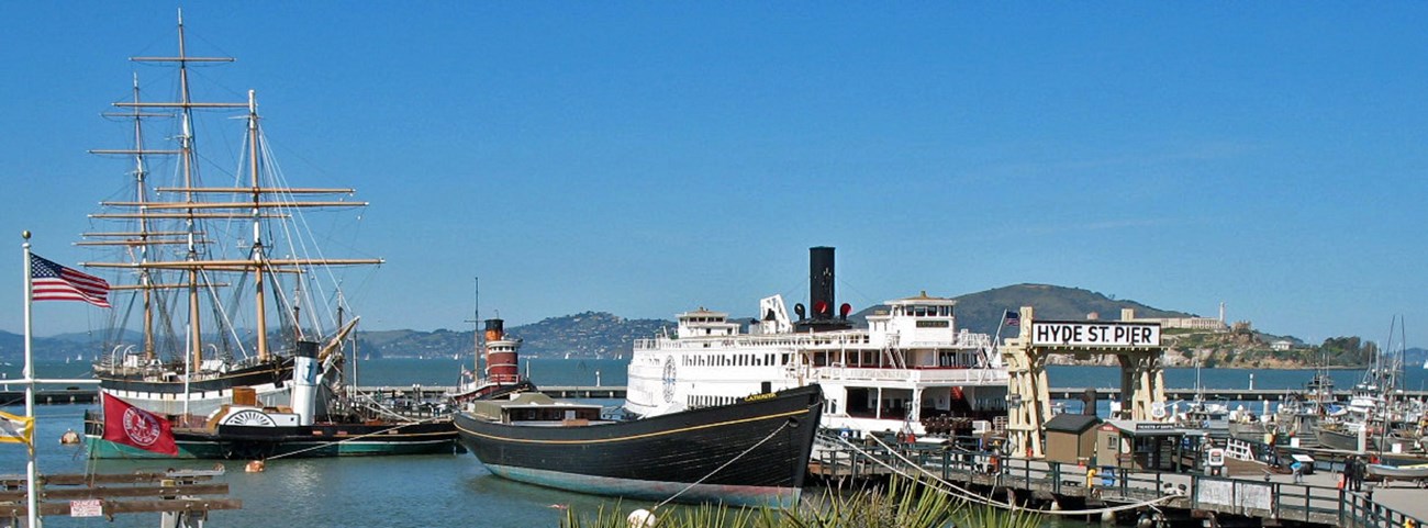 Boats docked in harbor.