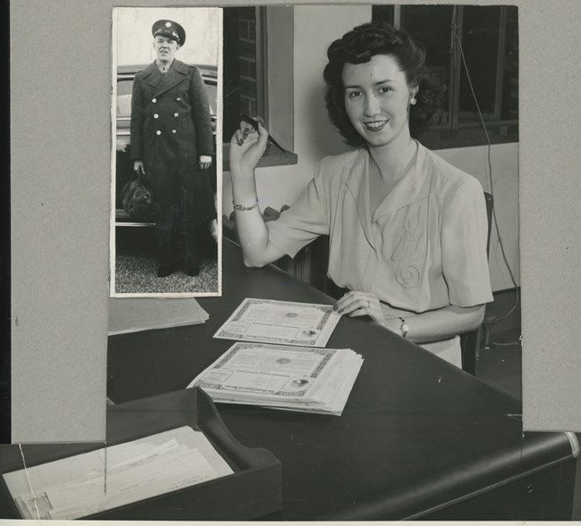 Black and white photo of woman signing certificates with a man in uniform superimposed on left side
