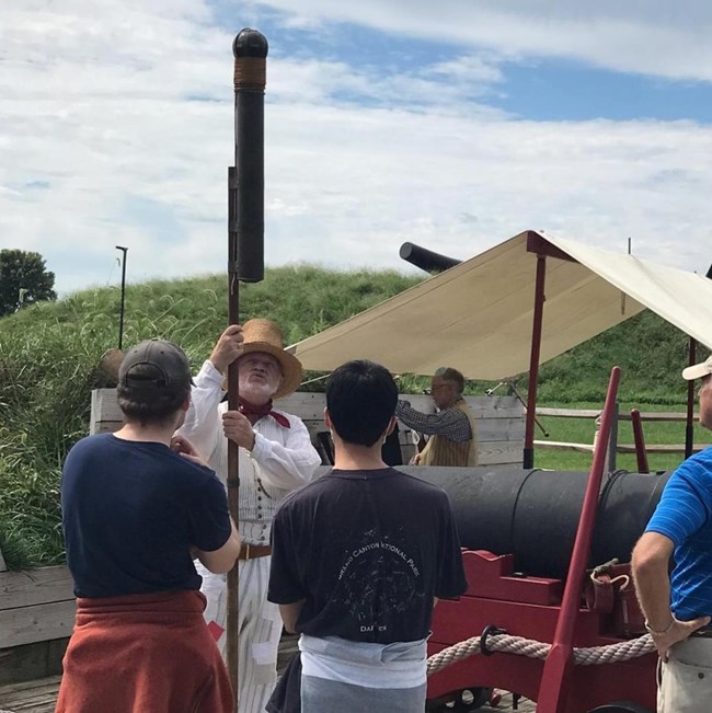 Sailor Jerry Sailor Jerry talking to visitors about a rocket, near the water battery