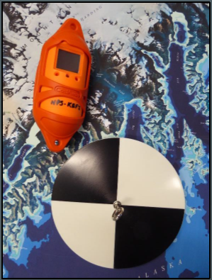 A small cylindrical orange CTD unit appears beside a flat round Secchi disc