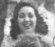 a young white woman with brown curly hair