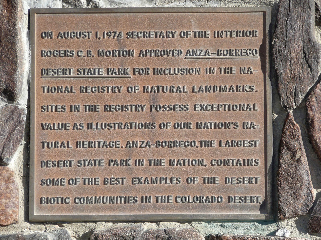 Photo of plaque saying Secretary of Interior C. B. Morton approved Anza-Borrego Desert State Park on 8/1/1974 for national registry of natural landmarks; value of NNLs, Anza-Borrego (some of best examples of desert biotic communities in Colorado Desert).