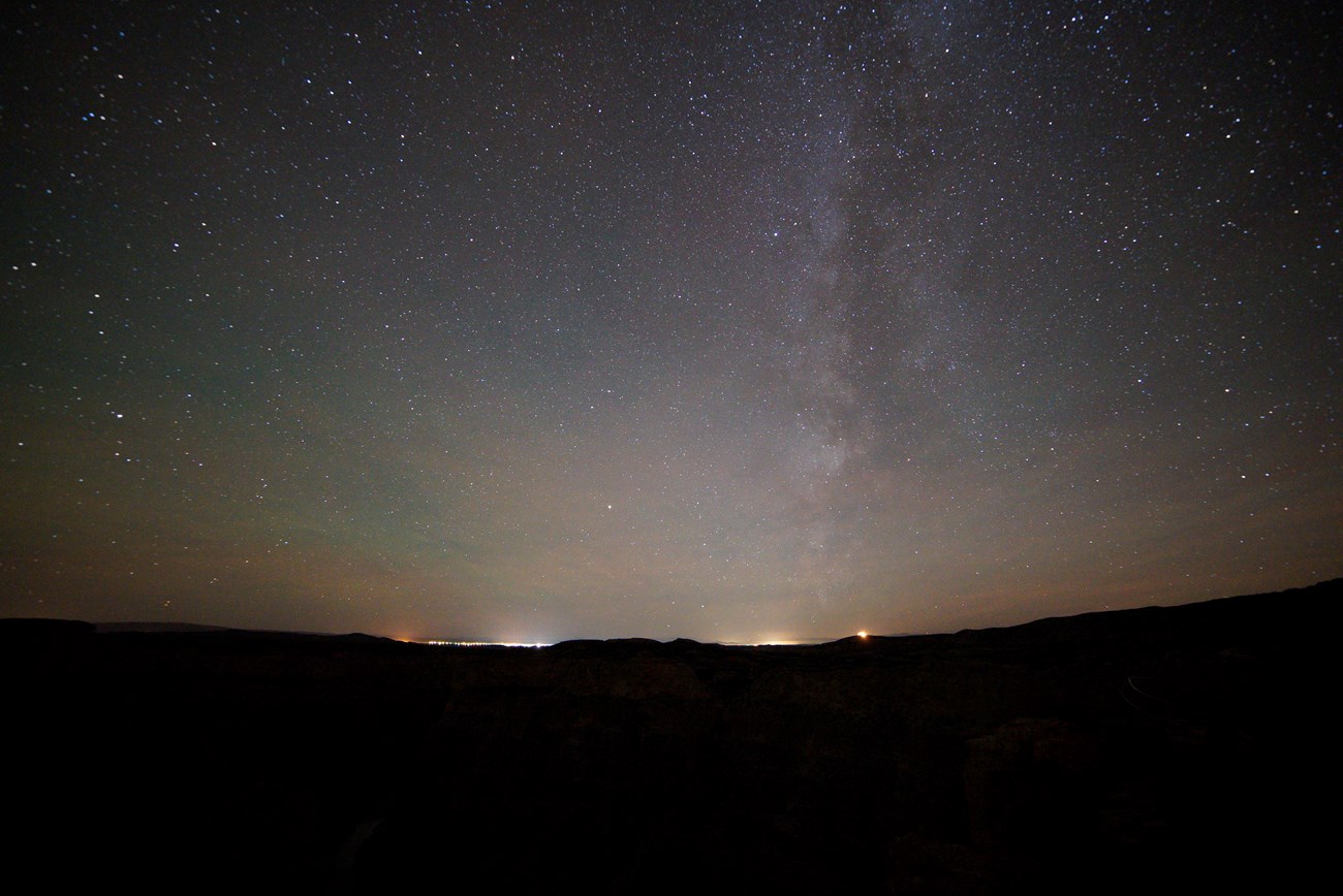 Sky glow from two distant cities affecting the night sky of Bighorn Canyon National Recreation Area