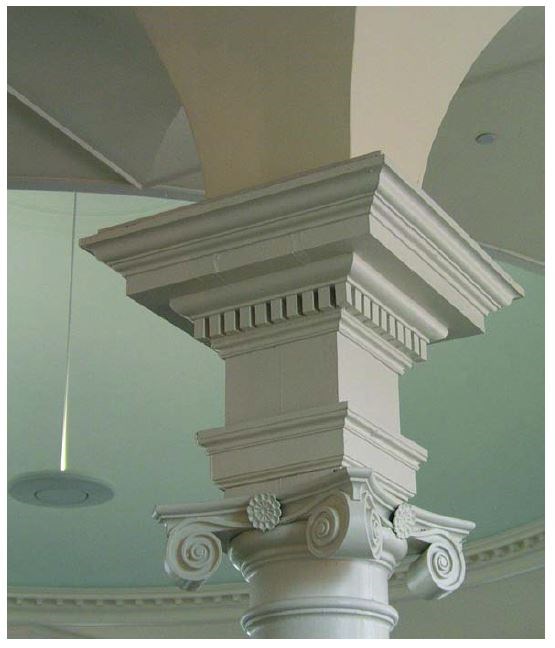 Ornate decorative trim at the top of a support post.