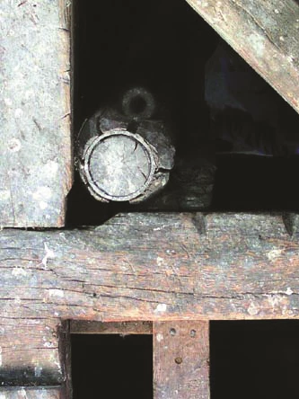 Insert Photo Large eyebolt in a notch of a vertical and horizontal beams.