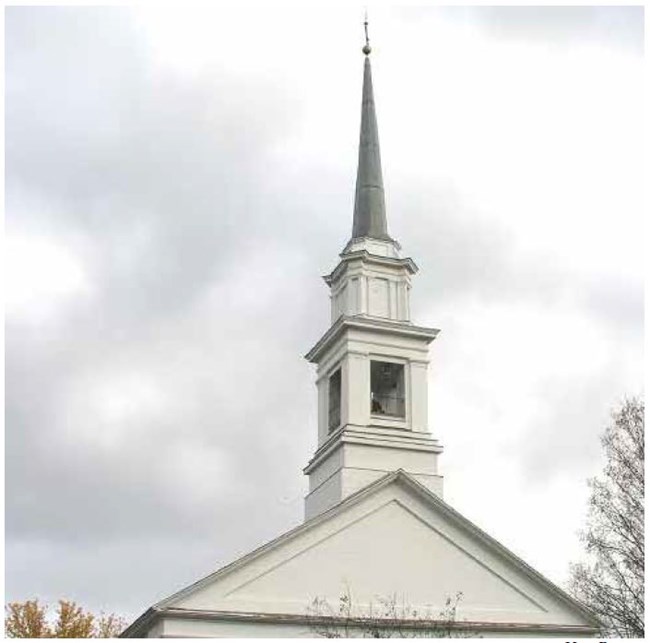 A white square steeple, with lantern and spire a top a single peaked roof.