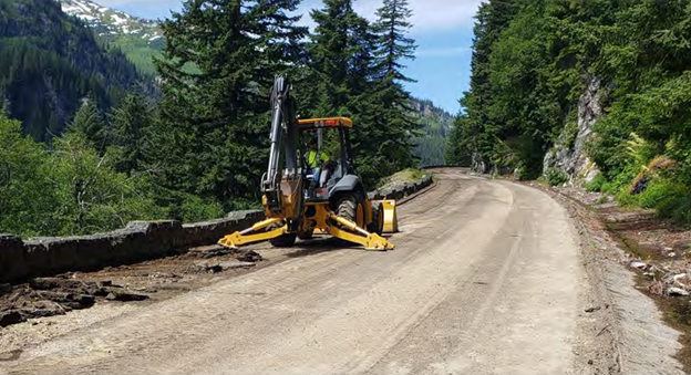 Stevens Canyon Road Construction A yellow construction vehicle sits upon a dirt road