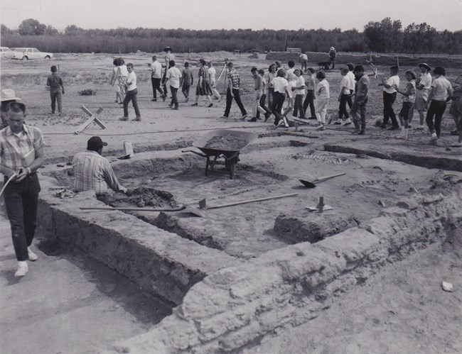 A Park Ranger leads a school group through the archeological site at Bents' Fort, 1964