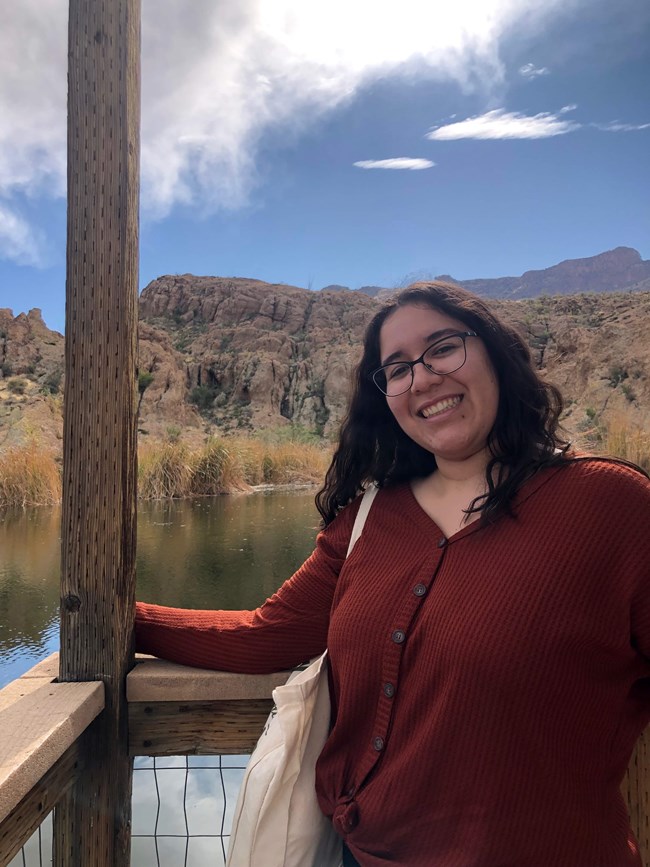 Suhey Ortega standing near a river in a canyon