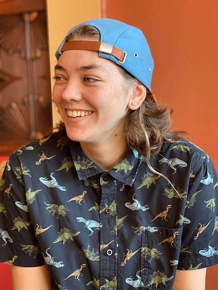 smiling woman wearing baseball cap