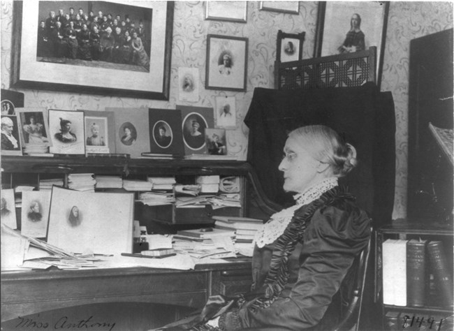 Susan B Anthony seated at a desk LOC