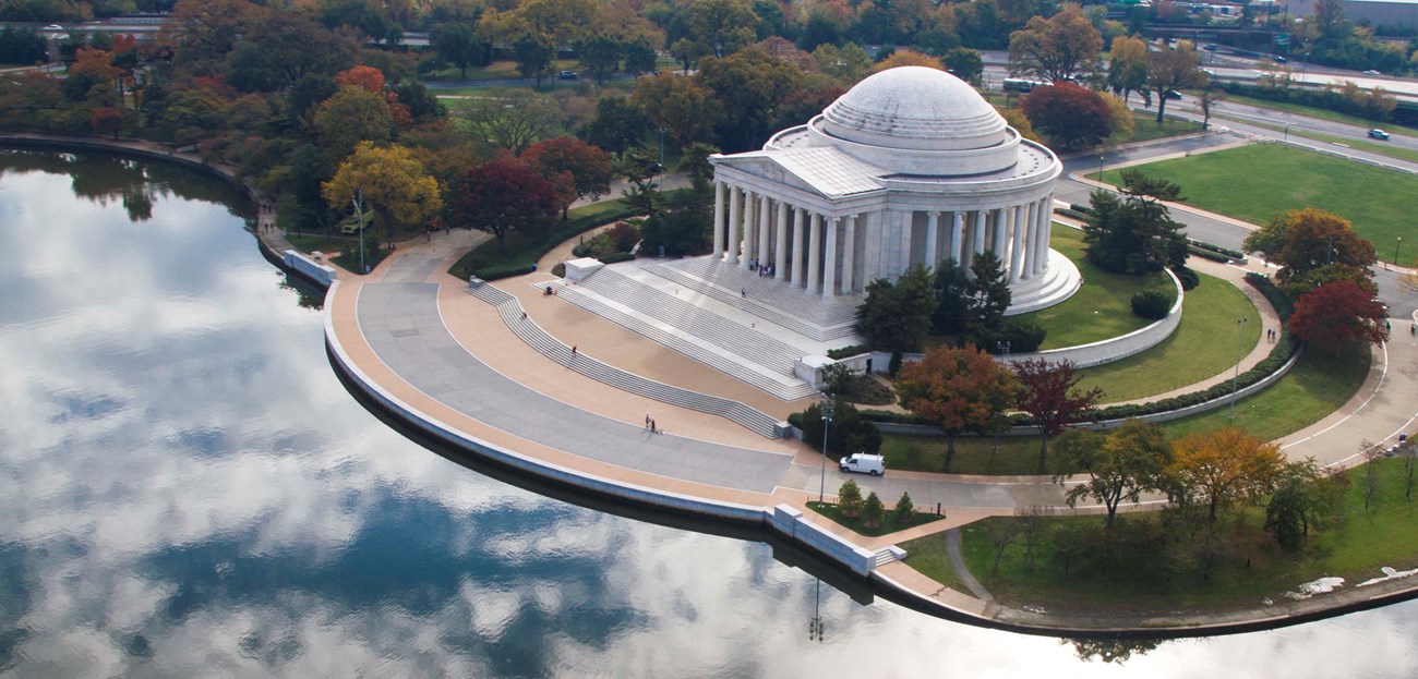 Classical-style domed temple memorial next to a tidal basin
