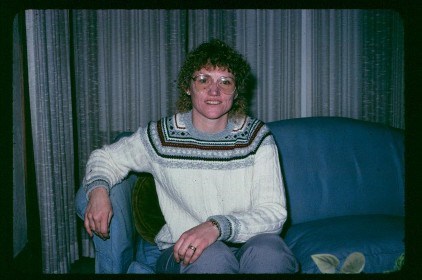 Photograph of Trudy Johnson, sitting on Trumans' couch
