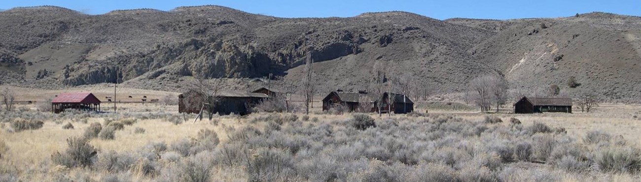 A few wooden buildings in a high desert