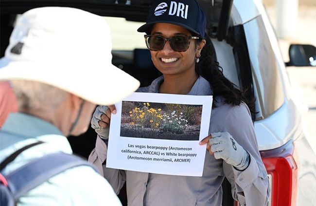 Person holding up a sign.