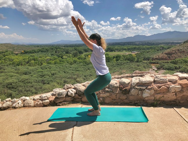 A Park Ranger demonstrates lightning bolt pose at Tuzigoot Pueblo. A Park Ranger demonstrates lightning bolt pose at Tuzigoot Pueblo.