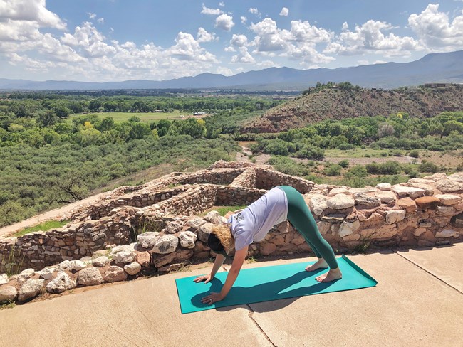 A Park Ranger demonstrates coyote pose at Tuzigoot Pueblo. A Park Ranger demonstrates coyote pose at Tuzigoot Pueblo.