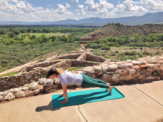 A Park Ranger demonstrates river pose at Tuzigoot Pueblo. A Park Ranger demonstrates river pose at Tuzigoot Pueblo.