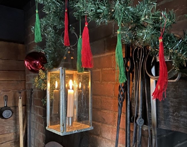 Tassel garland Green and red tassels attached to a string to make a garland.