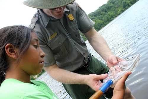 Teacher-Ranger-Teacher and Student A student checking water quality with a Teacher-Ranger-Teacher at the Mississippi National River and Recreation Area