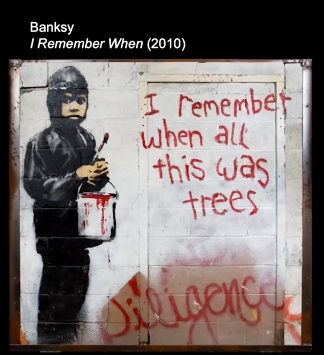 Banksy, "I Remember When" (2010). Paint on masonry of a boy with a brush and bucket of red paint who wrote "I remember when all this was trees."
