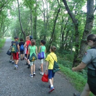 Photo credit: NPS Image / C&O Canal NHP Youth with Park Ranger walking along a trail.