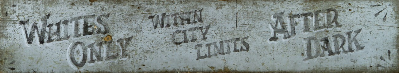 Sundown town sign c. 1900. A sundown town sign from 1900 in Macon, Georgia that reads "Whites only within city limits after dark."