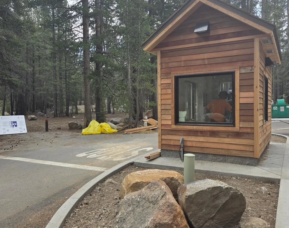 Tuolumne Meadows Campground Kiosk (2025) Wooden kiosk located along roadside in the forest