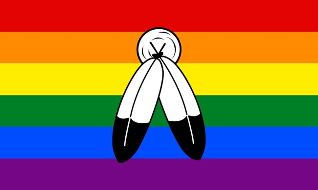 Rainbow flag with a Native symbol overlaid signifying the Two Spirit identity