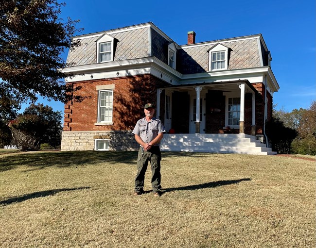 Richard Hill stands in front of a historic structure at Fort Donelson.