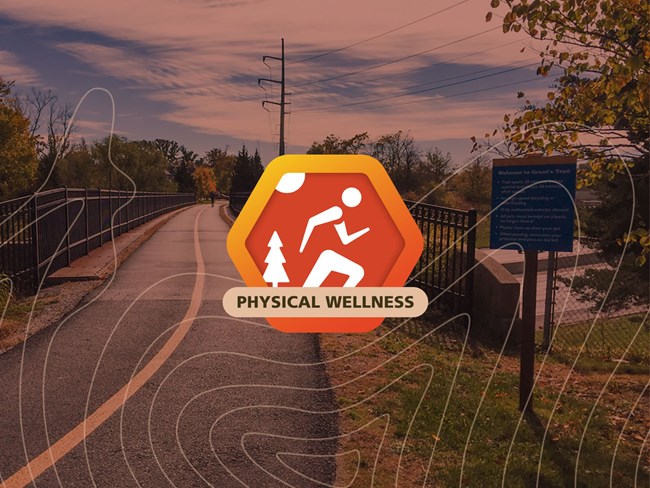 Red Octagon with person running and tree in the middle. A bike trail is seen in the background.