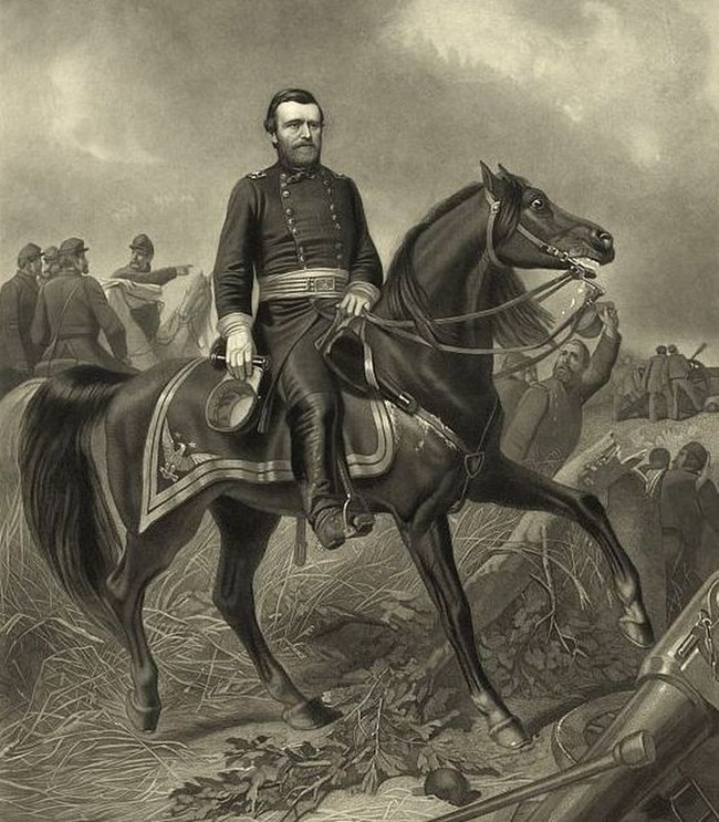 Bearded man wearing U.S. Army uniform riding a horse in an open field with soldiers standing in the background.