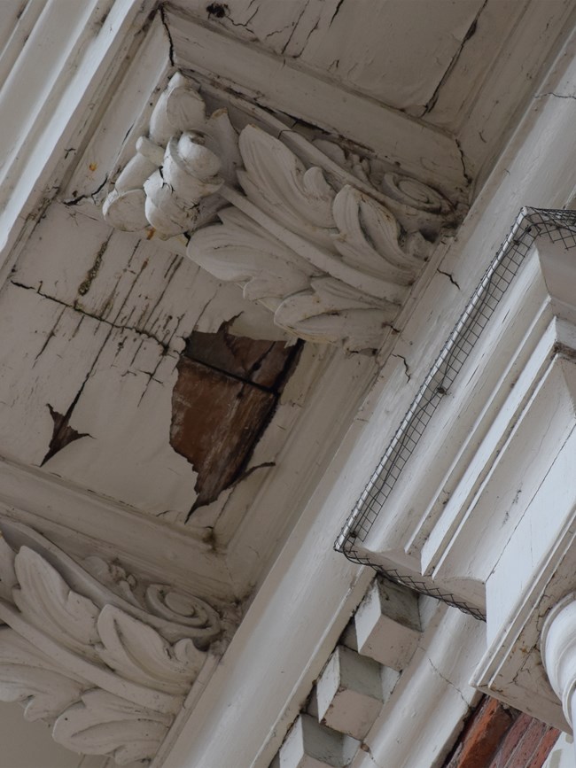 Work that needs to be addressed at Independence Hall Peeling paint on Independence Hall