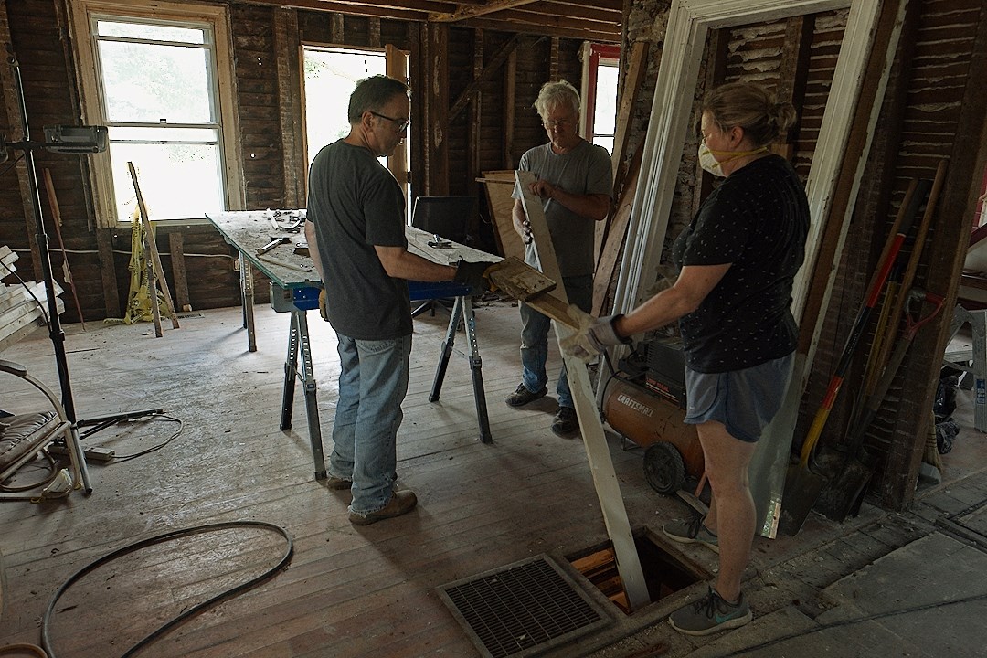 Oviatt House volunteers inside the historic house working together
