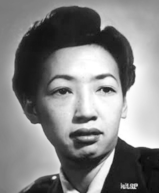 Portrait image of an Asian American woman in military uniform with the insignia "WASP"