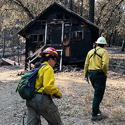 Aftermath of Carr Fire in Whiskeytown NRA NPS employees asses damage to burnt historic cabin