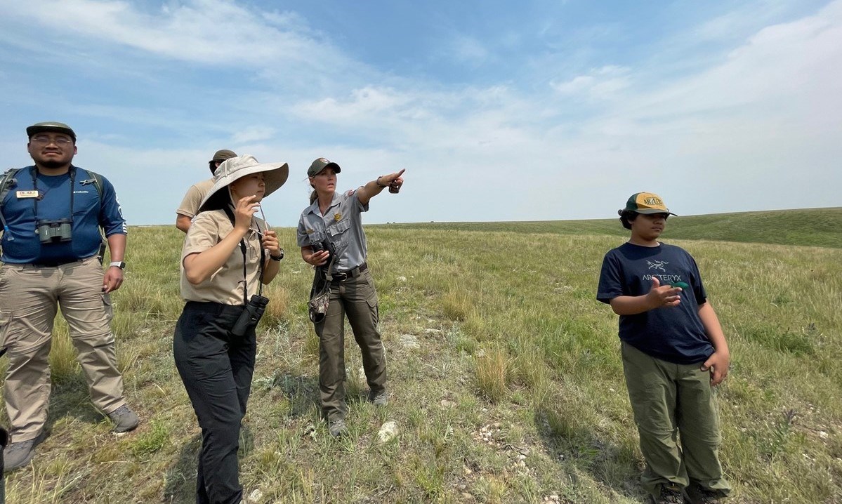 WICA Ranger Pointing Ranger pointing at something off camera for a group of interns