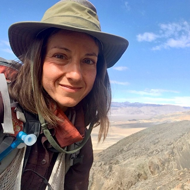 Christina Aiello closeup of woman standing in desert