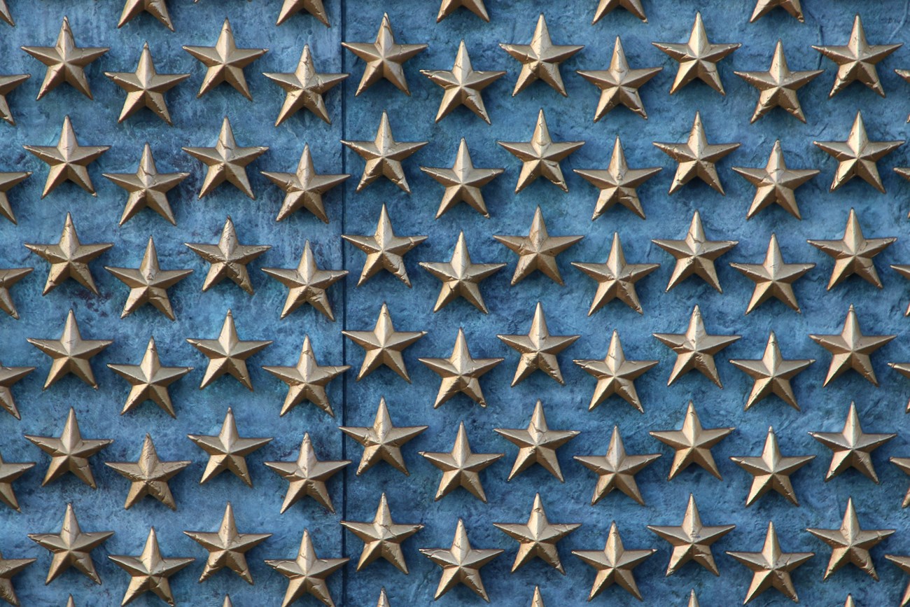 Gold stars on a blue wall