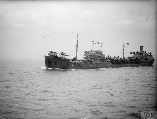 SS Wallace E Pratt Black and white photo of an oil tanker at sea, bearing aircraft for transport