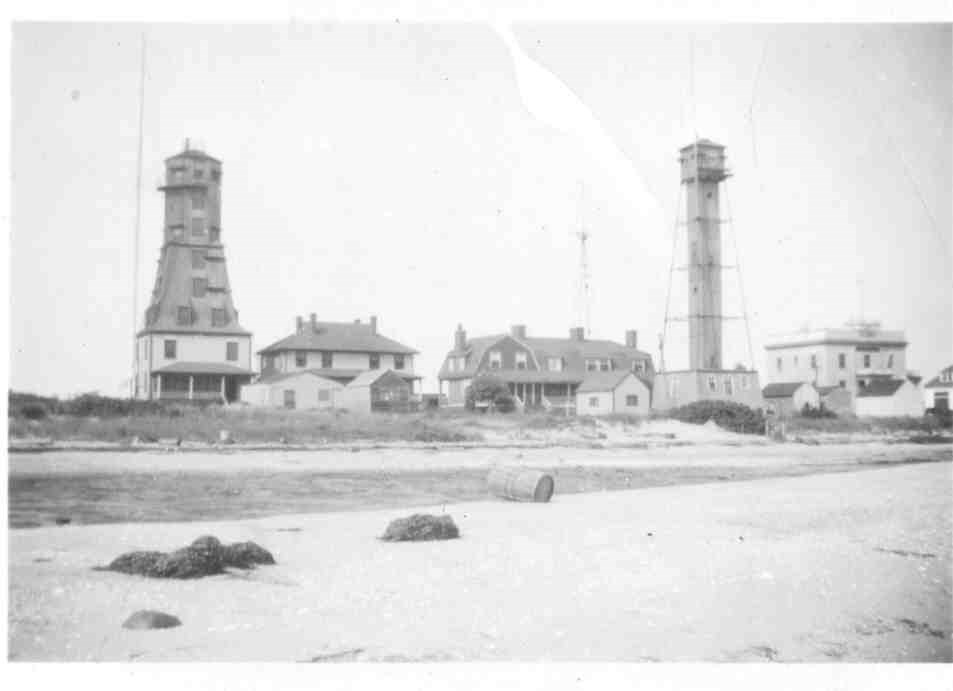 Two tall structures on either side of a residential building