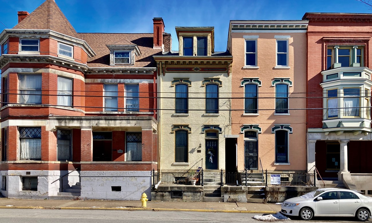 Wheeling Historic nineteenth century brick buildings in various colors and detailed facades line bright city street