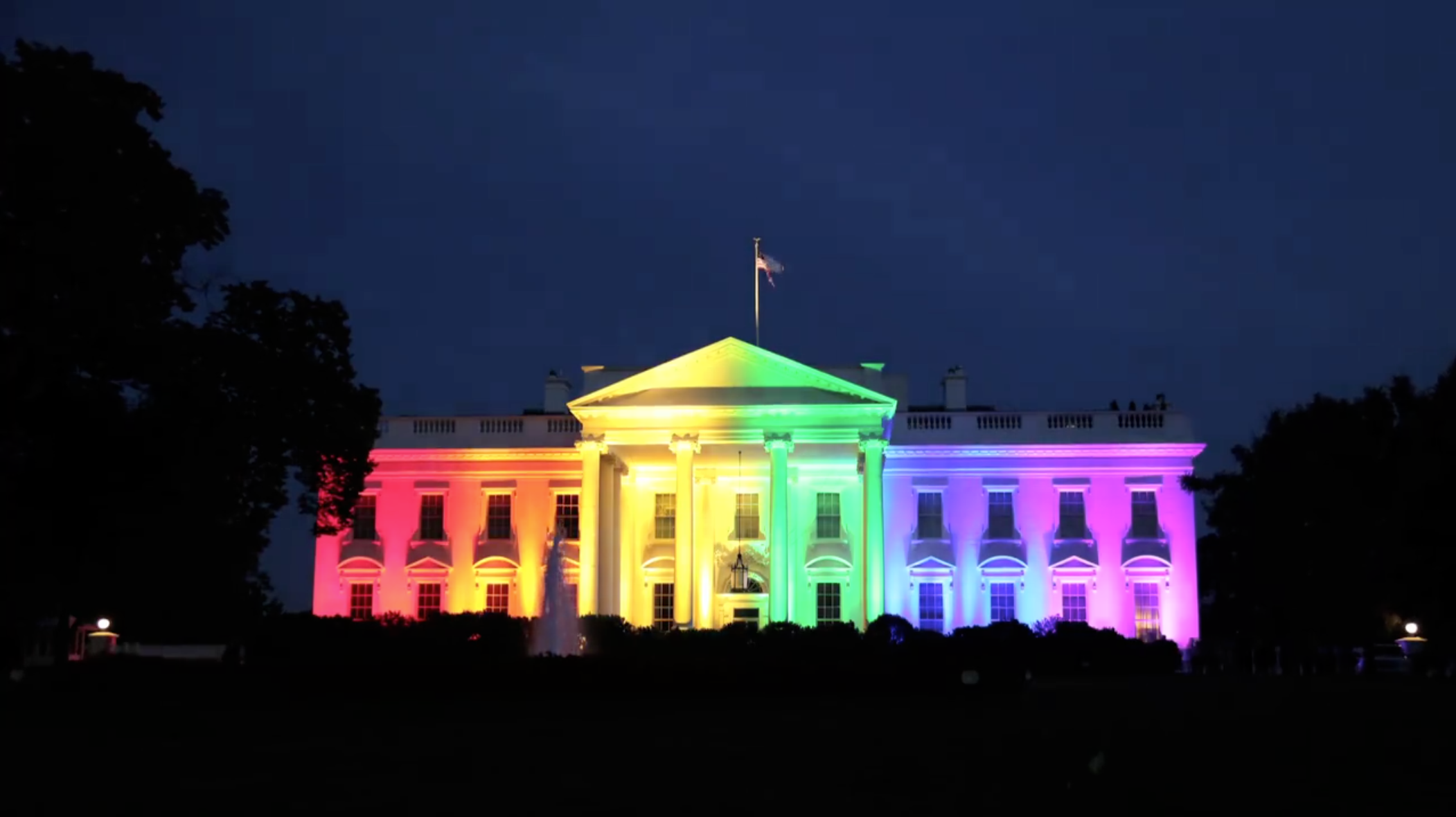 The White House is decorated in Rainbow lights.