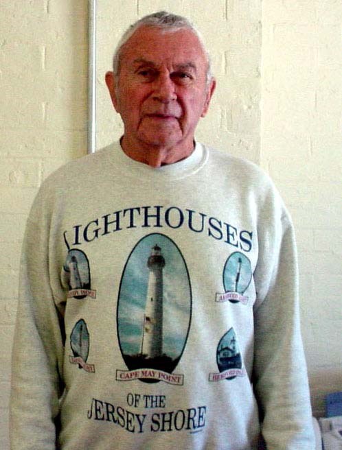 an old white man in a lighthouse sweatshirt